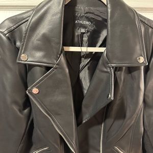 Faux Leather Jacket (New) Stretch material underarm adds to your comfort.